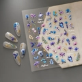 Detail of 5D embossed nail stickers featuring blue floral motifs and gold accents - Blue and Purple Flowers with Hummingbirds (CO-291)