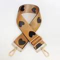 Detail of adjustable khaki nylon bag strap with black jacquard hearts and gold hardware - No. 22 + Gold Hook (Tan with Black Heart)