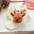 Close-up of cream knitted Christmas pet scarf with a cute brown reindeer emblem - S / White