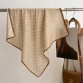 Detail of khaki floral silk scarf hanging on a metal rack with aesthetic display - Khaki / 68*68cm