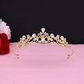 Close-up of golden baroque bridal crown featuring floral filigree and pear-shaped rhinestones - No.12 KC Gold (White Stone)