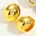 Macro shot of minimalist high-polished gold plated dome earrings on ivory background - Gold Eggshell