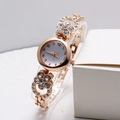Orologio al quarzo da donna in oro rosa con cinturino floreale a farfalla e cristalli - Stile Fiore Oro Rosa