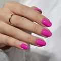 Glossy bright pink almond shaped press-on nails with minimalist gold ring on finger - Bright Pink Oval Style (CW393) / 24 Pcs/Set
