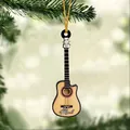 Close-up of guitar-shaped acrylic ornament with Mark name on a green Christmas tree - Classic Wood with Black Edge