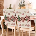 Detail showing pink cartoon motifs and festive text on a beige fabric Christmas chair cover - Pink Cartoon Guitar (YT02-31)