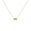 Elegant gold chain necklace featuring a rectangular emerald gemstone with beaded bezel - Green