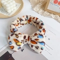 Colorful leopard print coral fleece headband with a large bow for skincare and makeup - Mixed Leopard