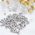 Polished silver metal spacer beads for DIY jewelry making in a white ceramic bowl - 2mm / White Gold