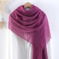 Wrinkled cotton linen scarf in vibrant purple with tassel edges on hanger - Fuschia