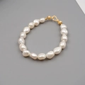 Elegant baroque freshwater pearl bracelet with a golden textured metal hook clasp - 8-9mm Baroque Pearl Bracelet