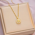 Elegant gold titanium steel necklace with a zircon clover pendant on a jewelry box - 6060 Circle Clover / Gold