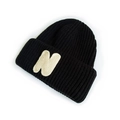Kids black knit beanie featuring a white embroidered letter N on the folded cuff - Black