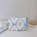 Floral cotton small storage pouch with blue bow and pink rose pattern on white desk - Light Blue Bow Quilted Small Rose