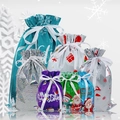 Blue and purple drawstring Christmas gift bags with snowflake and Santa Claus patterns - Christmas Gift Bag Assortment