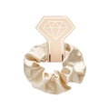 Detailed view of a champagne satin scrunchie with silk luster on a diamond display card - With Card / Beige