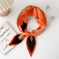 Pleated silk-like square scarf with orange and black geometric pattern on white background - Hibiscus Flower Orange Red