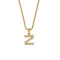 Macro detail of a gold twist chain necklace with a zircon-inlaid letter Z pendant - Letter Z