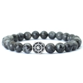 Macro detail of natural labradorite beaded bracelet with engraved silver compass charm - Larvikite