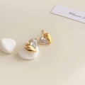 18K gold plated asymmetric heart earrings with pear-cut zircon on cream background - 18K Gold Plated Golden Heart Zirconia Studs