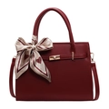 Elegant burgundy tote bag with gold lock and heart-patterned silk scarf on white background - Red