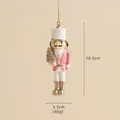 Pink and gold Nutcracker soldier ornament holding a mini glittery Christmas tree - Pink Soldier Holding Tree