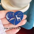 Close-up of heart-shaped enamel pin with starry whale and deer forest scenery - Whale and Deer Pair
