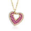 Detail of heart-shaped MOM pendant with pink and white pavé crystals on gold-plated base - Pink Rhinestone Hollow Ornate Style (E163)