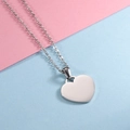 Polished heart pendant necklace in stainless steel on pink and blue background - Steel