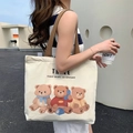 Off-white canvas tote bag featuring three teddy bears print and brown woven shoulder strap - Three Bears - Beige