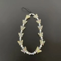 Detail of colorful transparent butterfly beads and white pearls on a phone wrist strap - Champagne Yellow Butterfly