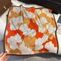 Elegant orange silk square scarf with floral prints and satin finish on plush rug - Orange Red (W-472-Orange Red)