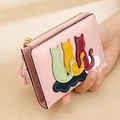 Close-up of pink short wallet with cute colorful cat silhouette embroidery and tassel - Pink