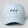 Detailed close-up of light blue cotton baseball cap featuring black palm tree silhouettes - One Size / Sky Blue (Black Coconut Tree)