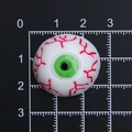 Flatback resin eyeball accessory with red bloodshot veins and green iris on grid ruler - Diameter 2.5cm / L Green