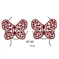Macro view of butterfly-shaped red crystal body stickers with multifaceted resin gems - XT-44 Dark Red Bow Jewel Sticker