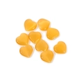 Group of small honey yellow heart-shaped cat eye stones scattered on white background - Golden Cat Eye