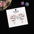 Detailed close-up of colorful rhinestone face gems arranged in a butterfly pattern on card - 165*155mm / Iridescent Red