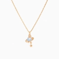 Macro shot of gold Saturn pendant with light blue orb and star charm on cross chain - Single Piece / Rose Gold / Blue Planet