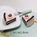 Macro shot of miniature resin cream cake charms showing dimensions 1.3x1.6x1.8cm - Chocolate Strawberry Triangle