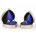 Golden heart-shaped jewelry box with blue LED spotlight and black velvet interior - Champagne