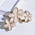 Detail of matte cream plumeria flower hair claw clip with three-flower resin design - Three-Flower Claw Clip / Light Khaki