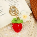 Handmade crochet strawberry keychain with white flower charm and golden metal ring - Strawberry with Flower