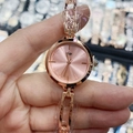 Detail of rose gold bracelet watch with pink dial and protective film in close-up shot - Rose Gold Pink Face