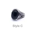 Detail of vintage men's steel ring with black gemstone and engraved side patterns - US 8 / Style C