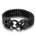 Gothic punk black stainless steel bracelet featuring dual skull head charms and spring clasp - Skull / Black