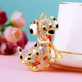 Golden Dalmatian dog keychain with sparkling rhinestones and black spots on pink surface - Classic Dalmatian White