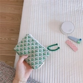 Close-up of mini jacquard canvas pouch with green floral pattern and cushion storage - Green