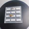 Clear acrylic 12-slot ring display stand featuring gold and silver gemstone rings - 12 Slots Brushed Base White Velvet 12*12CM