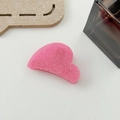 Detailed view of pink glitter heart-shaped resin hair claw clip with a glossy finish - Pink